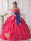 Formentera Spain Ball Gown Coral Red Sash Appliques and Beaded Decorate Bust Sweet 16 Dresses With a blue bow.